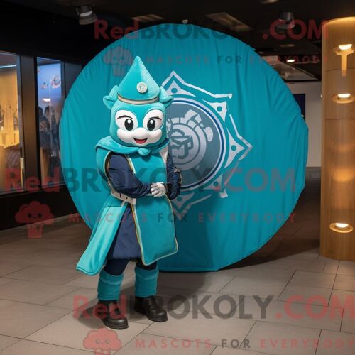 Costume De Mascotte Redbrokoly De Bouclier Celtique Turquoise Habillé D Un Blouson Aviateur Et D Anneaux
