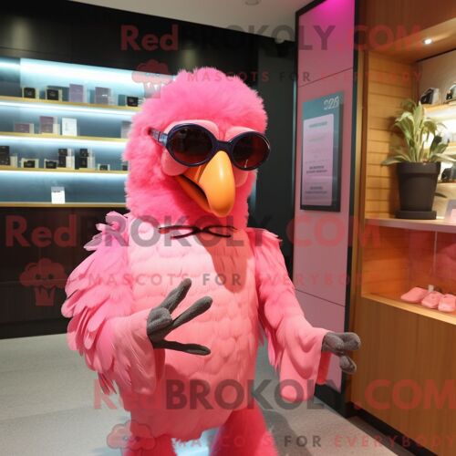 Costume De Mascotte Redbrokoly De Perroquet Rose Habillé Avec Un T-Shirt À Manches Longues Et Des Lunettes De Soleil