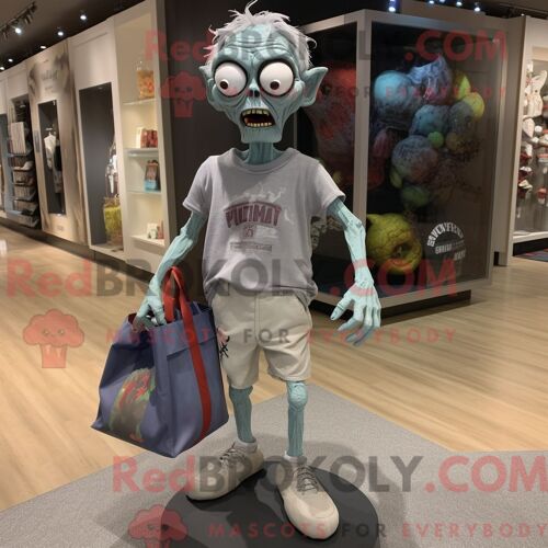 Personnage Mascotte Redbrokoly De Zombie Gris Habillé D Un Short Et De Sacs Fourre-Tout