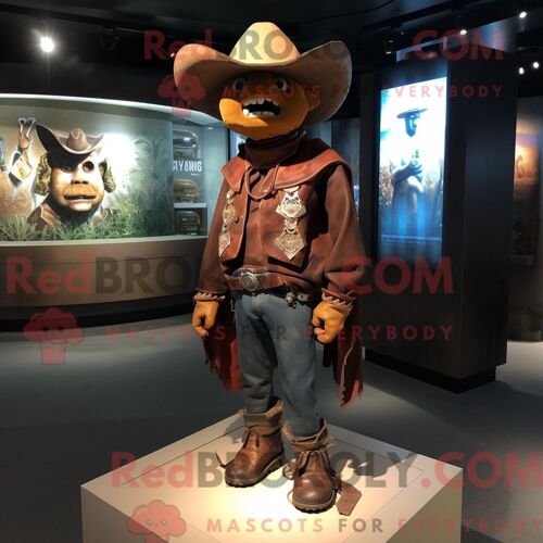 Personnage De Costume De Mascotte Redbrokoly De Cowboy Rust Habillé Avec Une Veste En Cuir Et Des Épingles À Châle