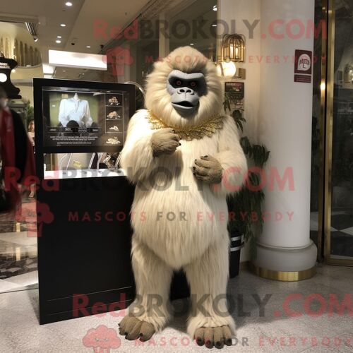 Costume Mascotte Redbrokoly De Gorille Beige Personnage Habillé Avec Une Robe Taille Empire Et Des Broches