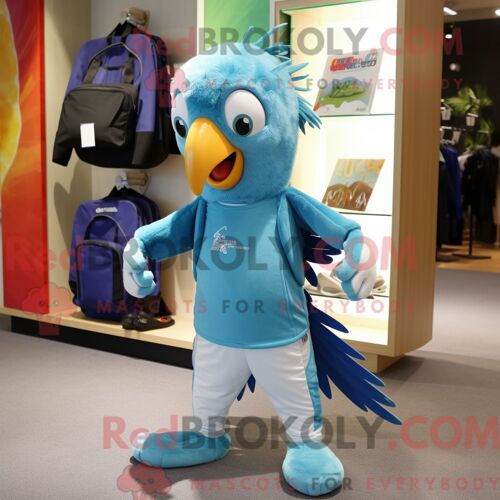 Personnage Mascotte Redbrokoly De Perroquet Cyan Habillé D Un Pantalon De Jogging Et De Sacs Fourre-Tout