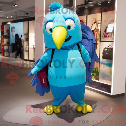Personnage Mascotte Redbrokoly De Perroquet Cyan Habillé D Un Pantalon De Jogging Et De Sacs Fourre-Tout