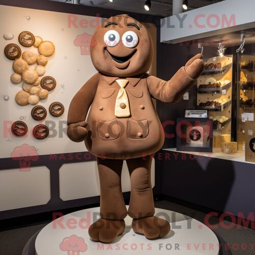 Personnage De Costume De Mascotte Redbrokoly De Chocolats Beiges Habillé Avec Une Barboteuse Et Des Boutons De Manchette