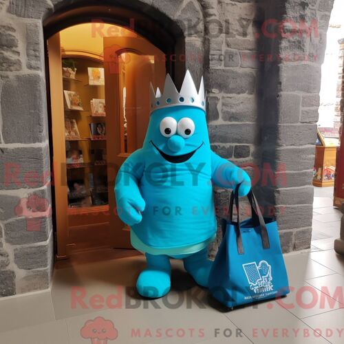 Personnage De Costume De Mascotte Redbrokoly De Château Irlandais Turquoise Habillé D Un T-Shirt À Col En V Et De Sacs Fourre-Tout