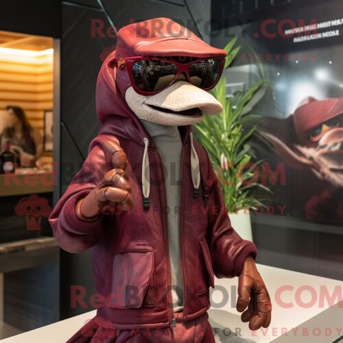 Costume Mascotte Redbrokoly De Dimorphodon Marron Habillé Avec Une Parka Et Des Lunettes De Soleil