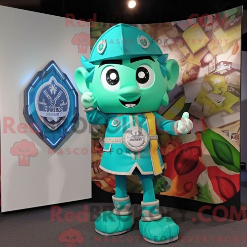Costume De Mascotte Redbrokoly De Bouclier Celtique Turquoise Habillé D Un Blouson Aviateur Et D Anneaux