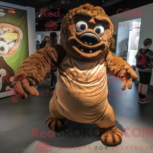 Costume Mascotte Redbrokoly De Contorsionniste Marron Habillé D Une Combinaison Et De Sacs Messager