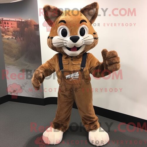 Costume Mascotte Redbrokoly De Bobcat Marron Habillé Avec Un Jean Skinny Et Des Mitaines