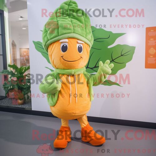 Personnage Mascotte Redbrokoly D Une Feuille De Chou Orange Habillée D Un Cardigan Et De Bonnets