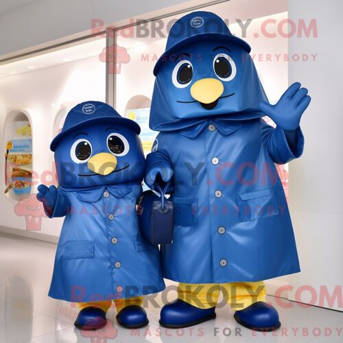 Costume Mascotte Redbrokoly De Navy Candy Personnage Habillé D Un Imperméable Et De Sacs Messager