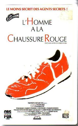 L'homme A La Chaussure Rouge