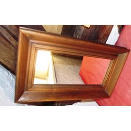 Miroir avec son cadre en bois Dimensions Longueur 45.5 cm largeur 26.5cm.