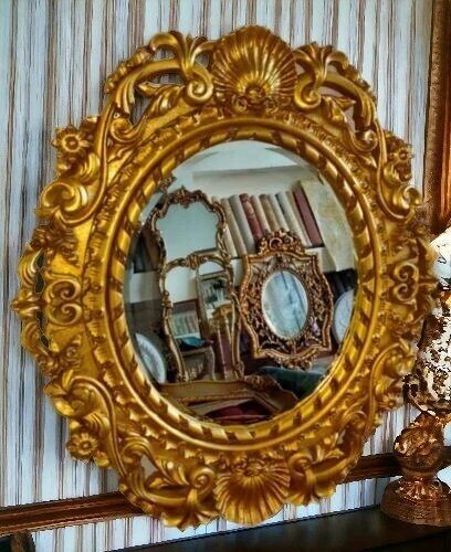 Un Miroir mural rond doré sculpte en bois hêtre style louis XV