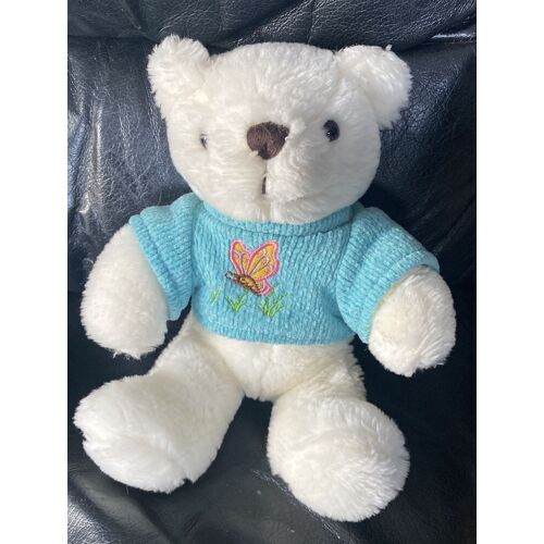 Doudou peluche ours blanc pull bleu papillon rose herbe verte 22cm