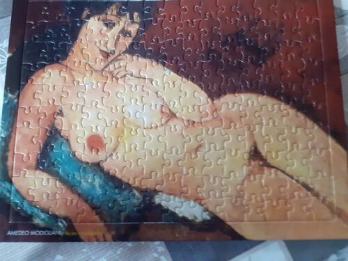 Puzzle Amadeo Modigliani ( Nu au coussin bleu ) de 150 pièces.Dimensions 23 ×30.
